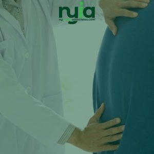 A doctor examines a patient's lower back by placing hands on the patient's back. The logo "nyja associates.com" appears at the top of the image.