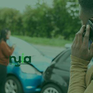 A man on a cell phone, possibly contacting an auto accident doctor in Freeport for assistance.